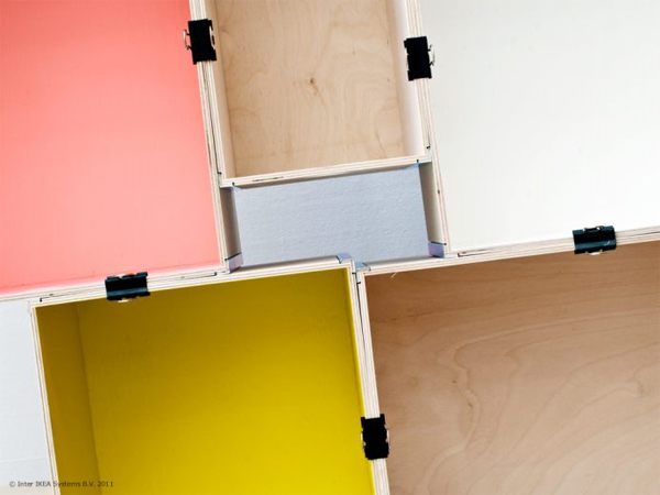 Using their plywood prant boxes and office paper clips, IKEA cleverly arranges them into a modern cubist storage unit.