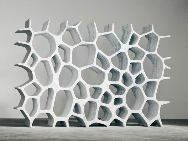 A modern storage unit, the Voronoi Shelf, made of white carrara marble designed by Australian bron furniture designer Marc Newson.