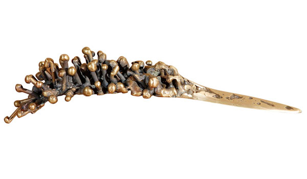 A bronze dagger letter opener by American artist and sculptor Mary Brogger.