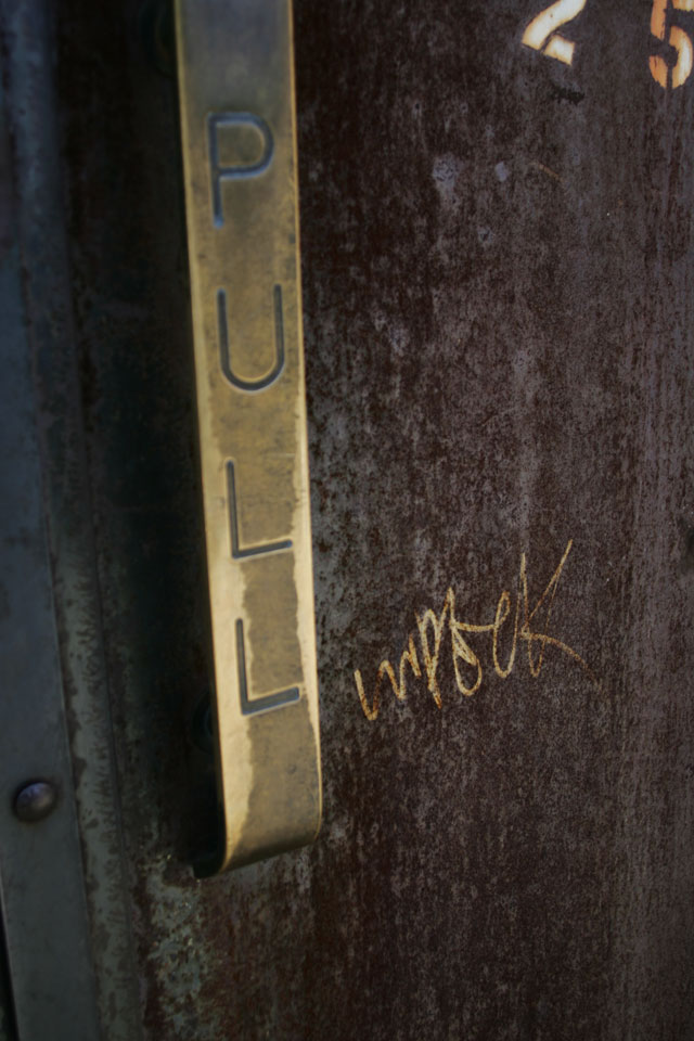 A rusty metal graffiti door in Williamsburg Brooklyn.