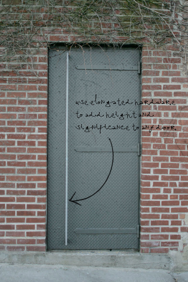 Grey painted steel doors with elongated modern hardware.