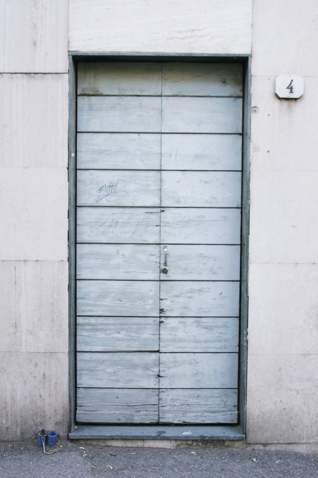 Italian, painted grey, wood graffiti door.