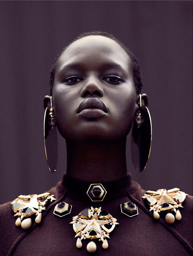 Fashion model Ajak Deng wearing Chanel, Balmain, Prada and Balenciaga with techno chic accessories.