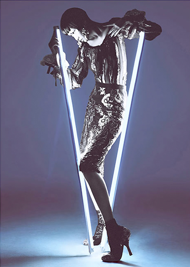 Charles Guo photographs model Wang Xiao wearing Tron inspired futuristic fashion.