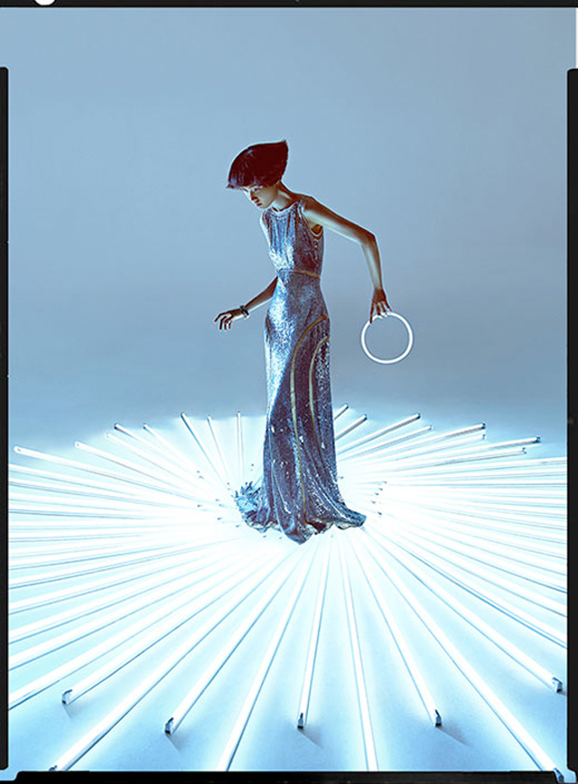 Charles Guo photographs model Wang Xiao wearing Tron inspired futuristic fashion.